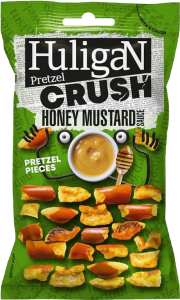 Pretzel Crush sabor miel y mostaza de Huligan en bolsa de 65 g. Snack salado-dulce con carácter, ideal para acompañar bebidas en el club social.
